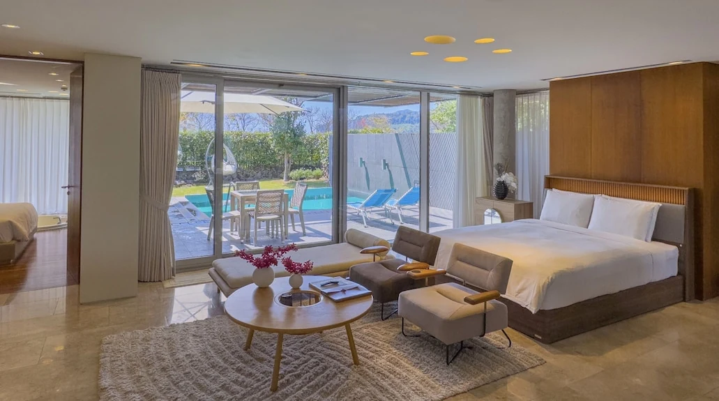 Bayhill private villa room opening onto the pool terrace