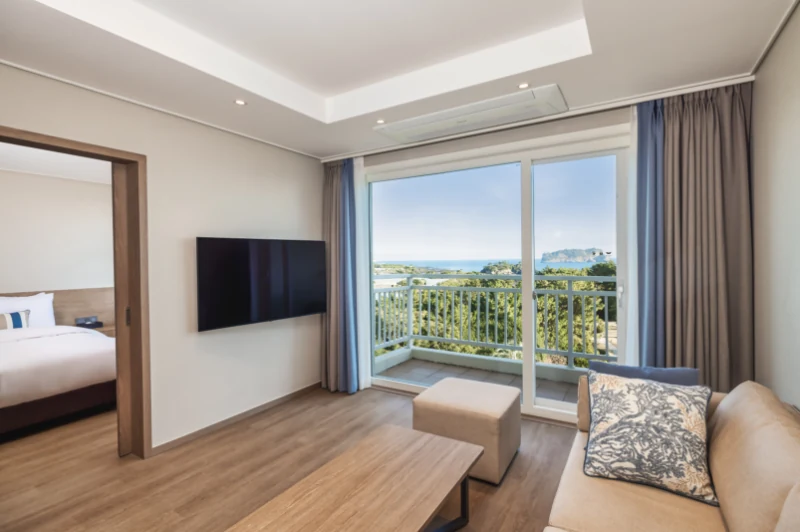 Real exact-property page ocean-view living area and balcony at Kensington Resort Seogwipo