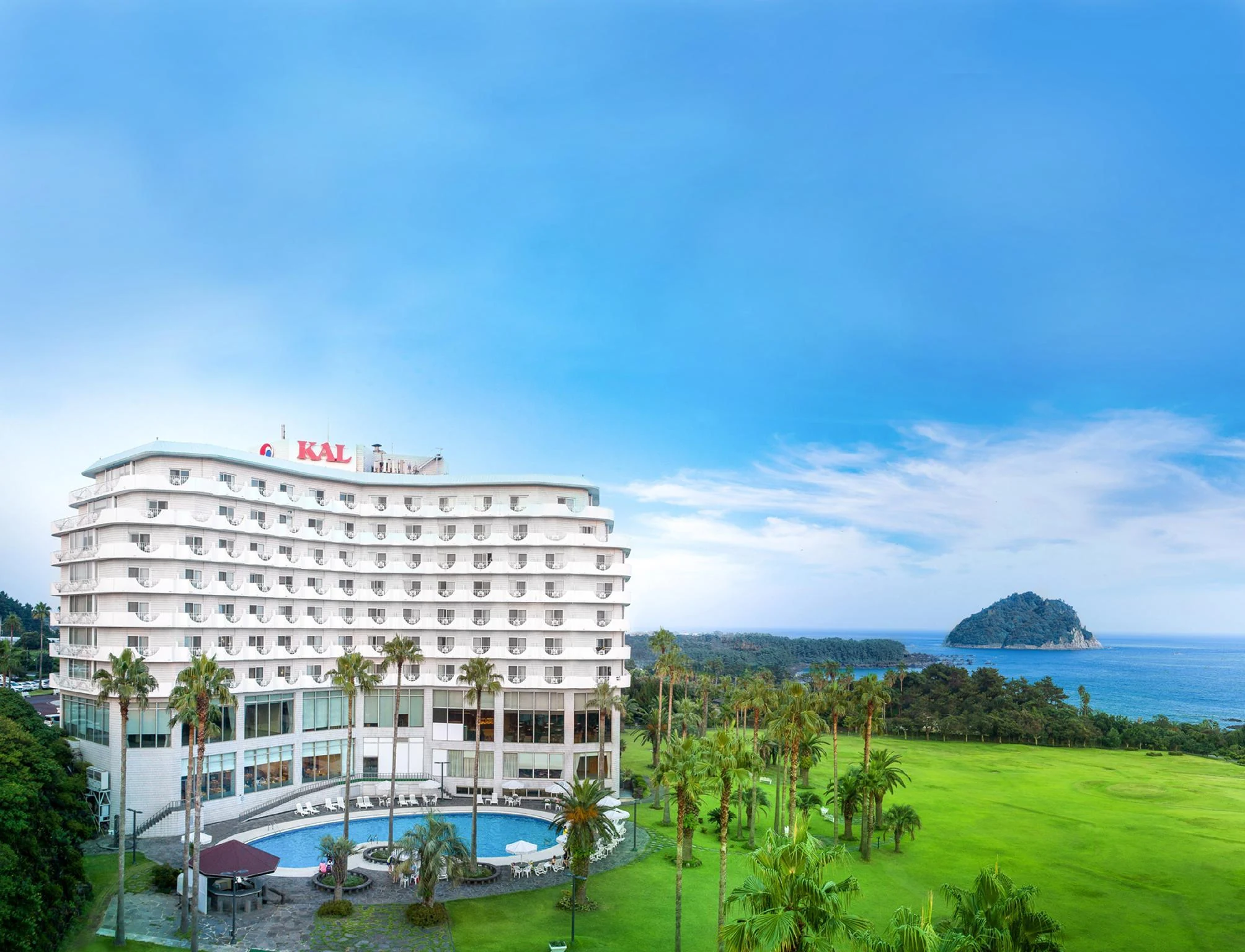 Seogwipo KAL Hotel exterior beside its gardens and outdoor pool