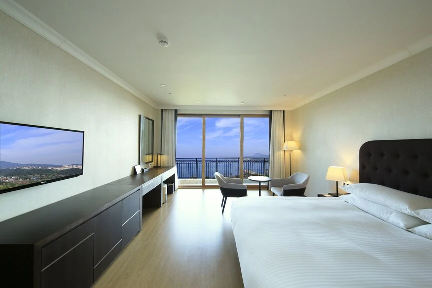 Jeju Booyoung Hotel guest room with a balcony view