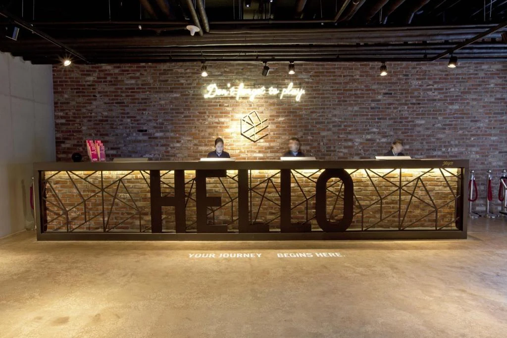 HELLO reception and common area at Playce Camp Jeju