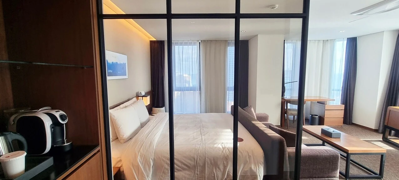 Guest-room image for Ramada Encore Haeundae; confirm the booked room category and bed layout.