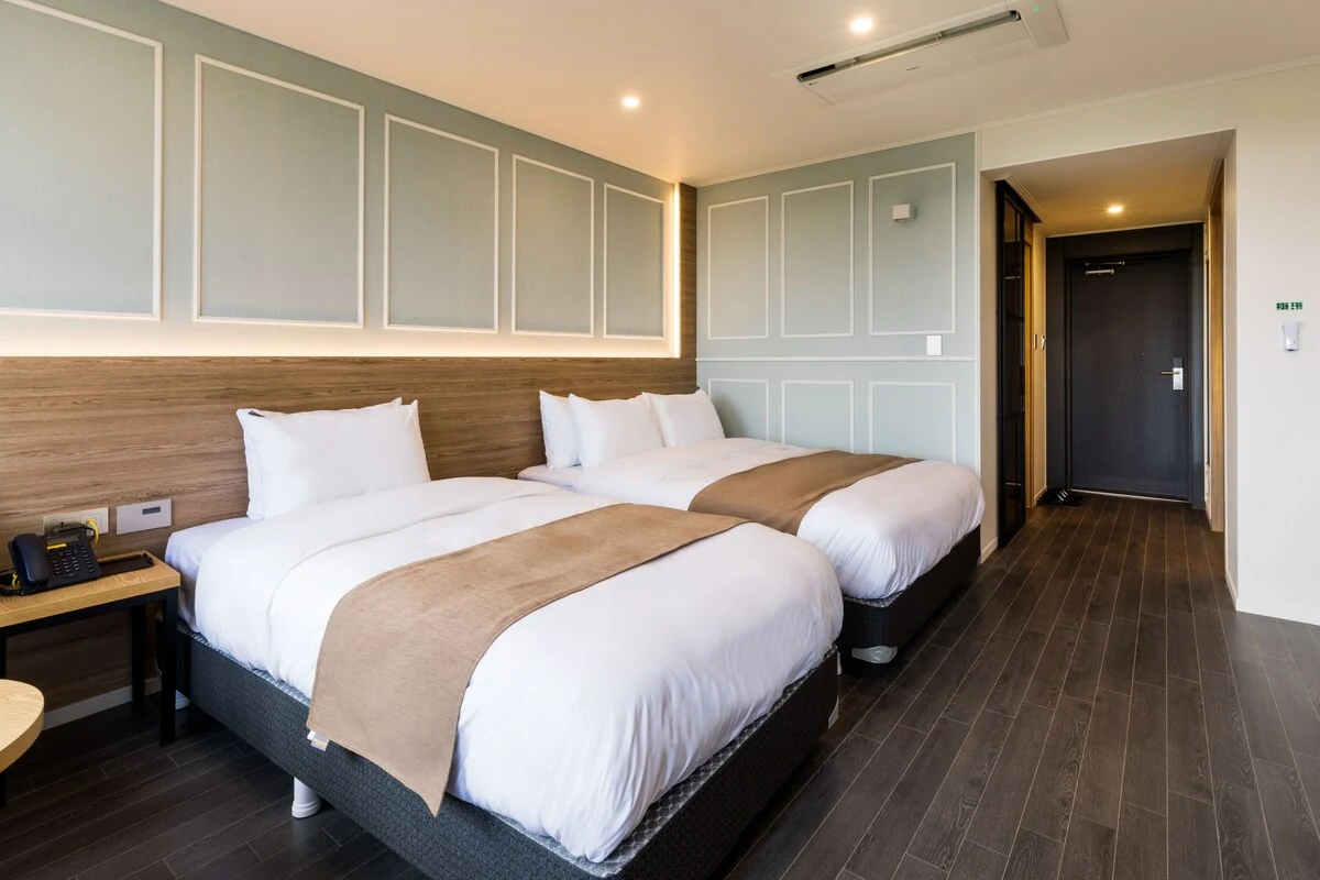 Hotel guest room with two beds; confirm the selected room’s bed arrangement and capacity.