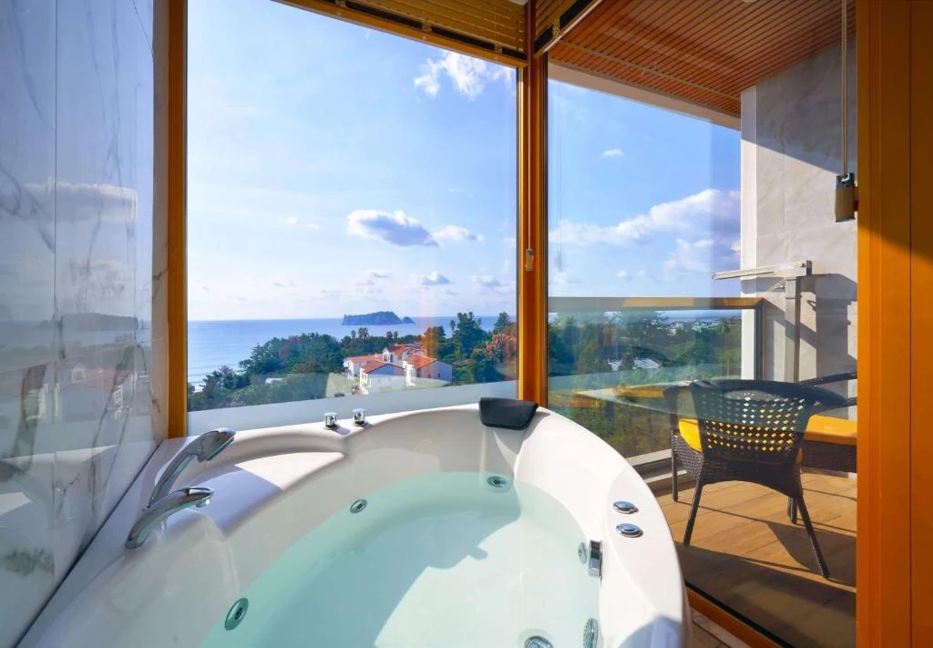 Real Korea travel scene related to GoldOne Hotel & Suites Jeju: treat the in-room Jacuzzi as a room right and the heated pool as a shared facility 3