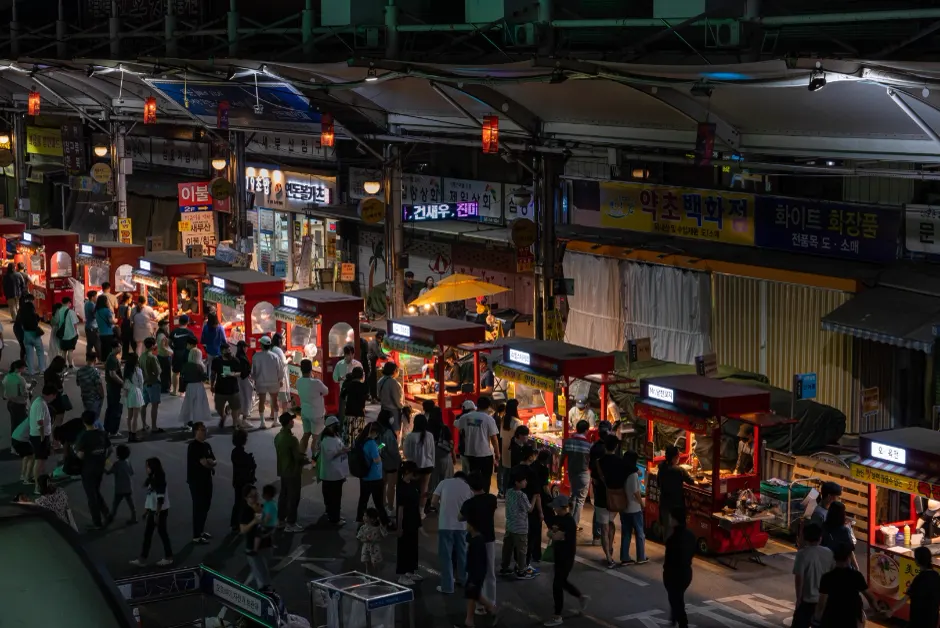 Red food carts and visitors viewed from above at Daegu Seomun Night Market