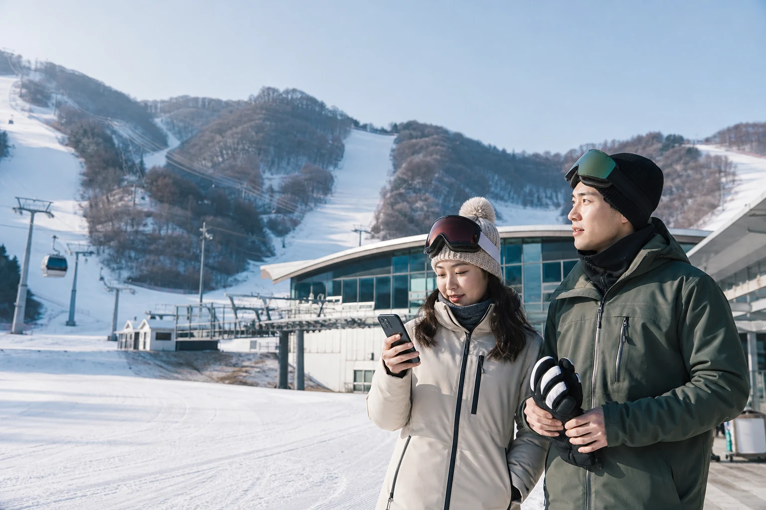 Traveler checking a phone and shuttle arrangements at a Korean ski resort base
