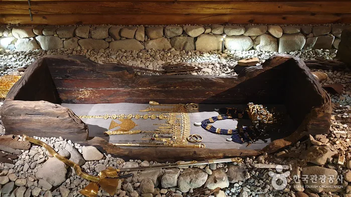 Reconstructed wooden-chamber tomb structure and burial display inside Cheonmachong