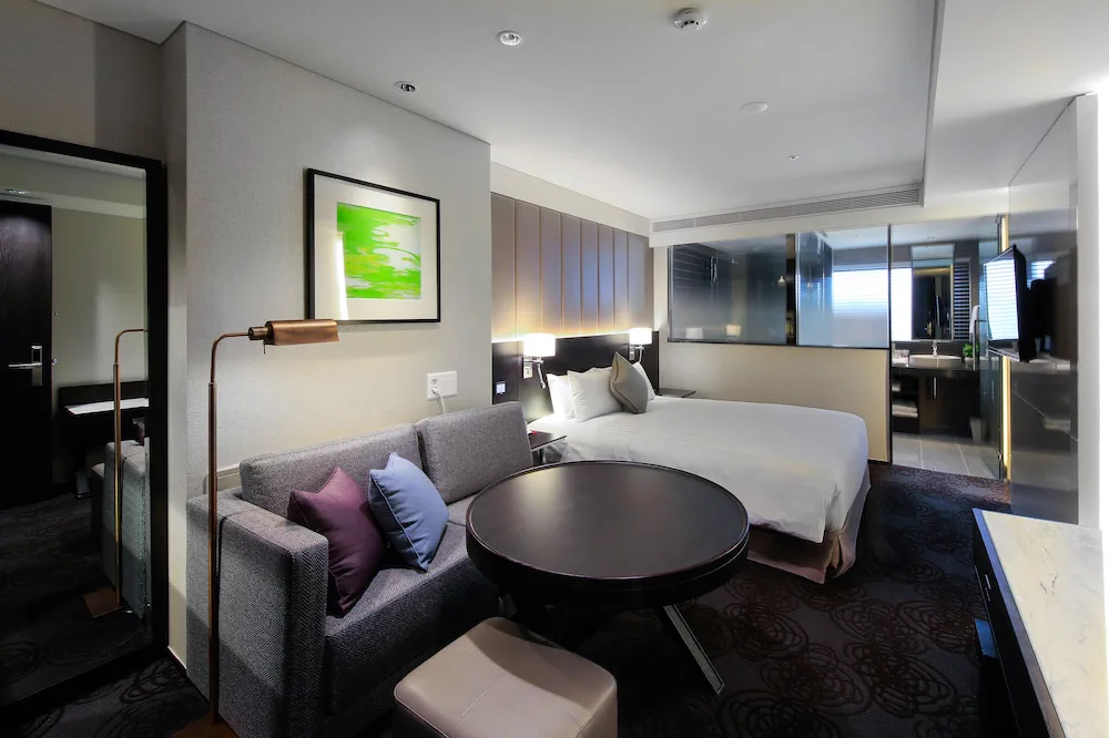 Guest room with a sofa at Solaria Nishitetsu Hotel Seoul Myeongdong