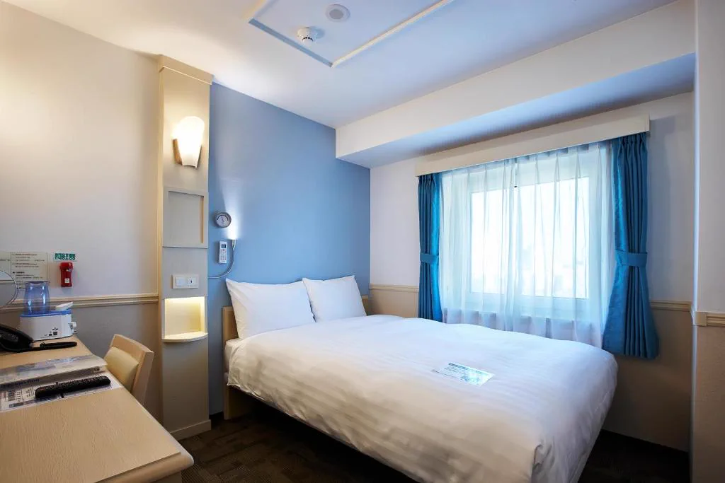 Another actual guest room bed and window view at Toyoko Inn Seoul Yeongdeungpo