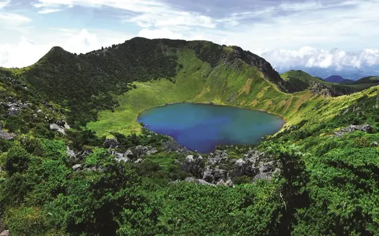 Baengnokdam crater lake and green volcanic walls on Hallasan