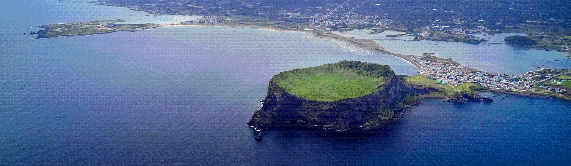 Aerial view of Seongsan Ilchulbong and eastern Jeju coast