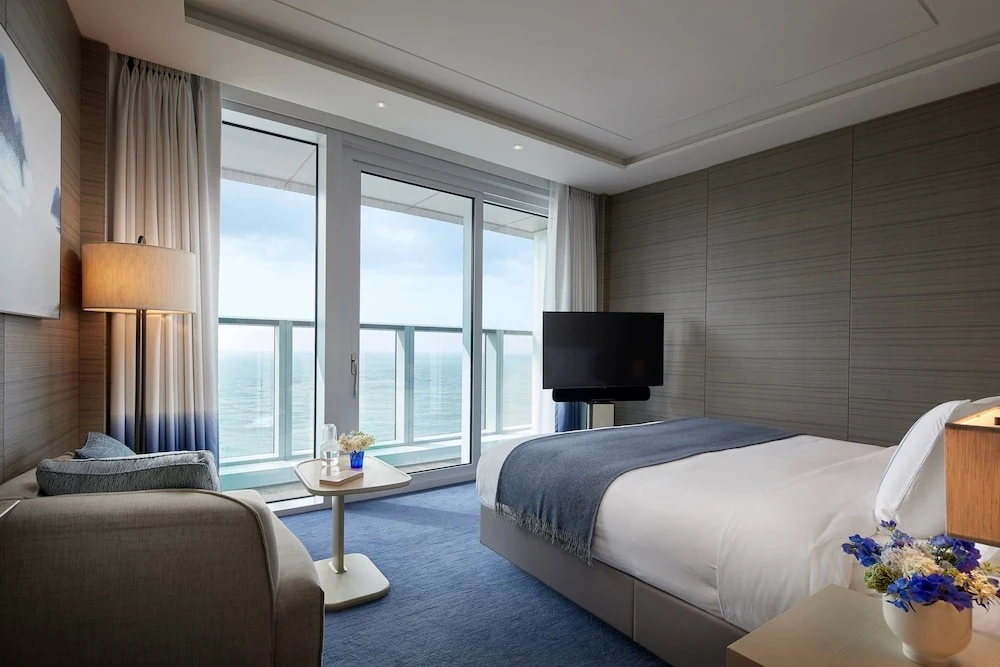 Real photos of SIGNIEL Busan ocean-view rooms with a private terrace