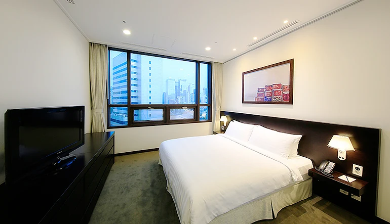 Bedroom with a bed in a Seoul serviced apartment