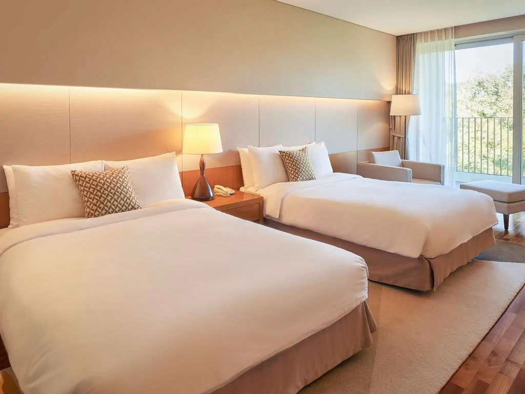 Official two-double guest room at Mercure Ambassador Jeju