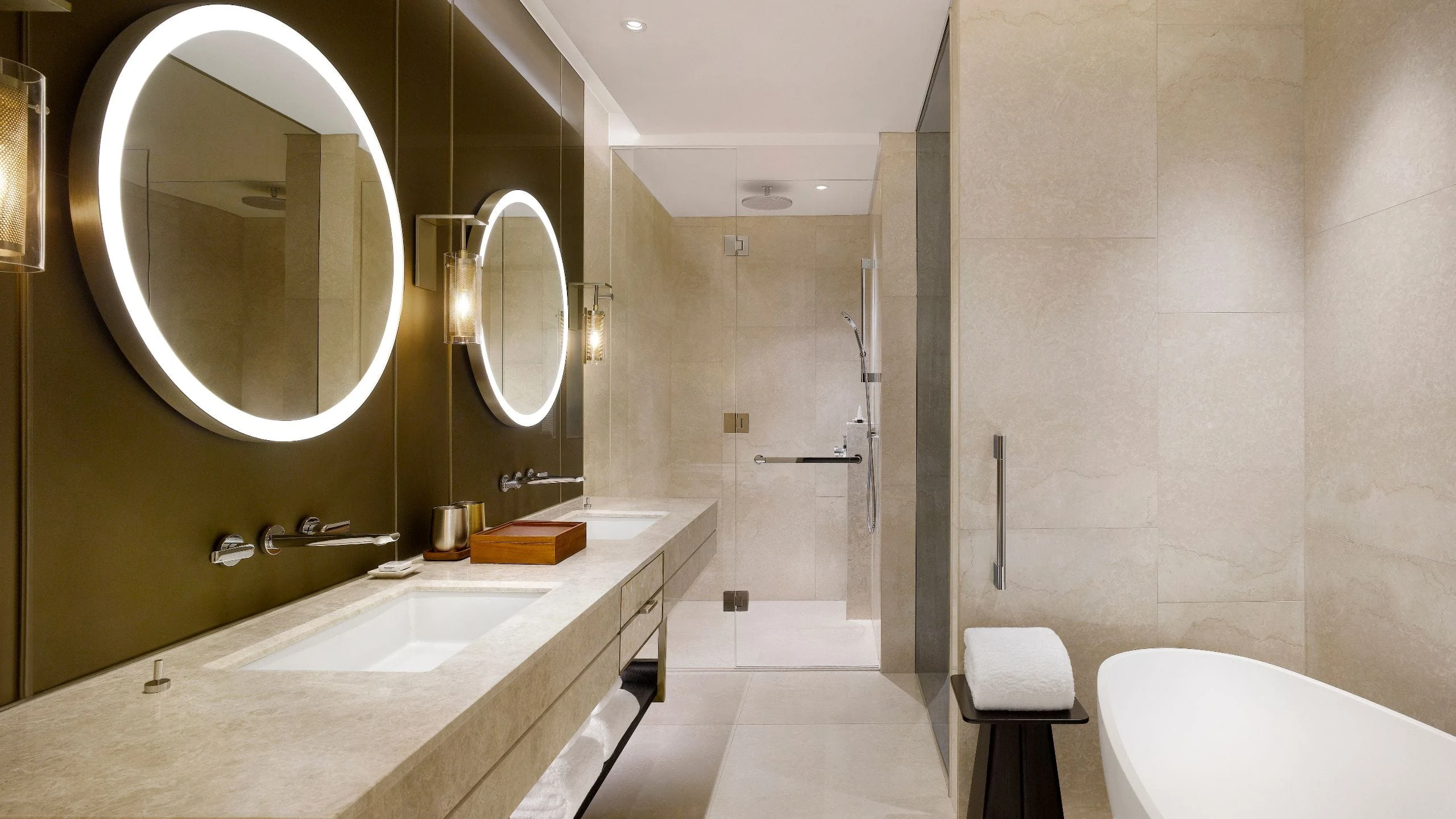 Hotel bathroom with double vanity, bathtub and separate shower