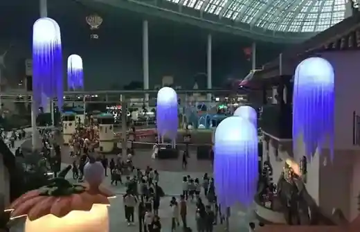 Lotte World Adventure indoor amusement park zone with a glass dome